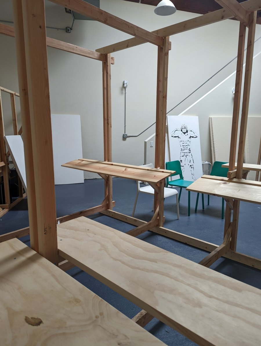 Timber painting station detail: bench seating with easel rails and work surfaces